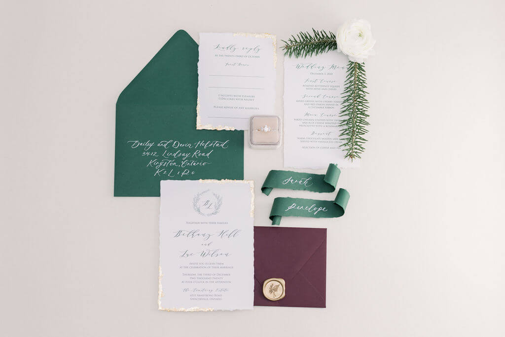 Weddind invitation with gold foil, calligraphy and green accents